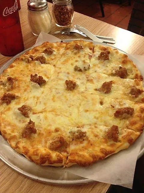 Sausage pizza on a metal pizza tray